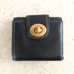 Coach black leather wallet with light pink interior. Lots of space inside